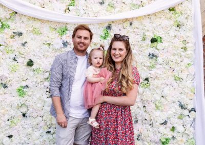 Family pictured by petal wall