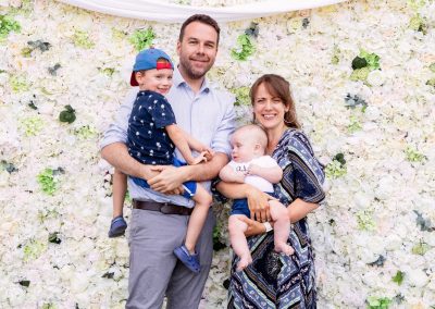 People in front of flower wall